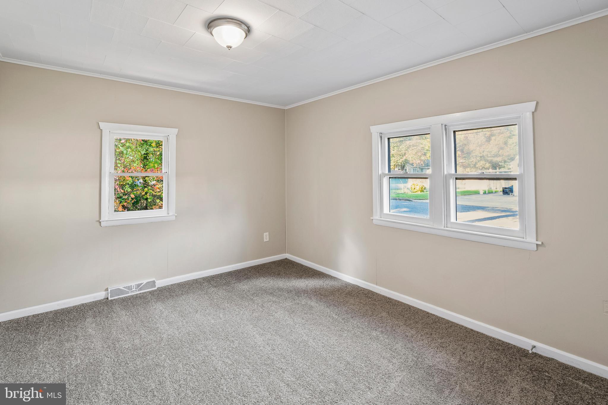 83 Rutgers Road Pennsville, NJ 08070 - Photo 13 of 23 an empty room with windows