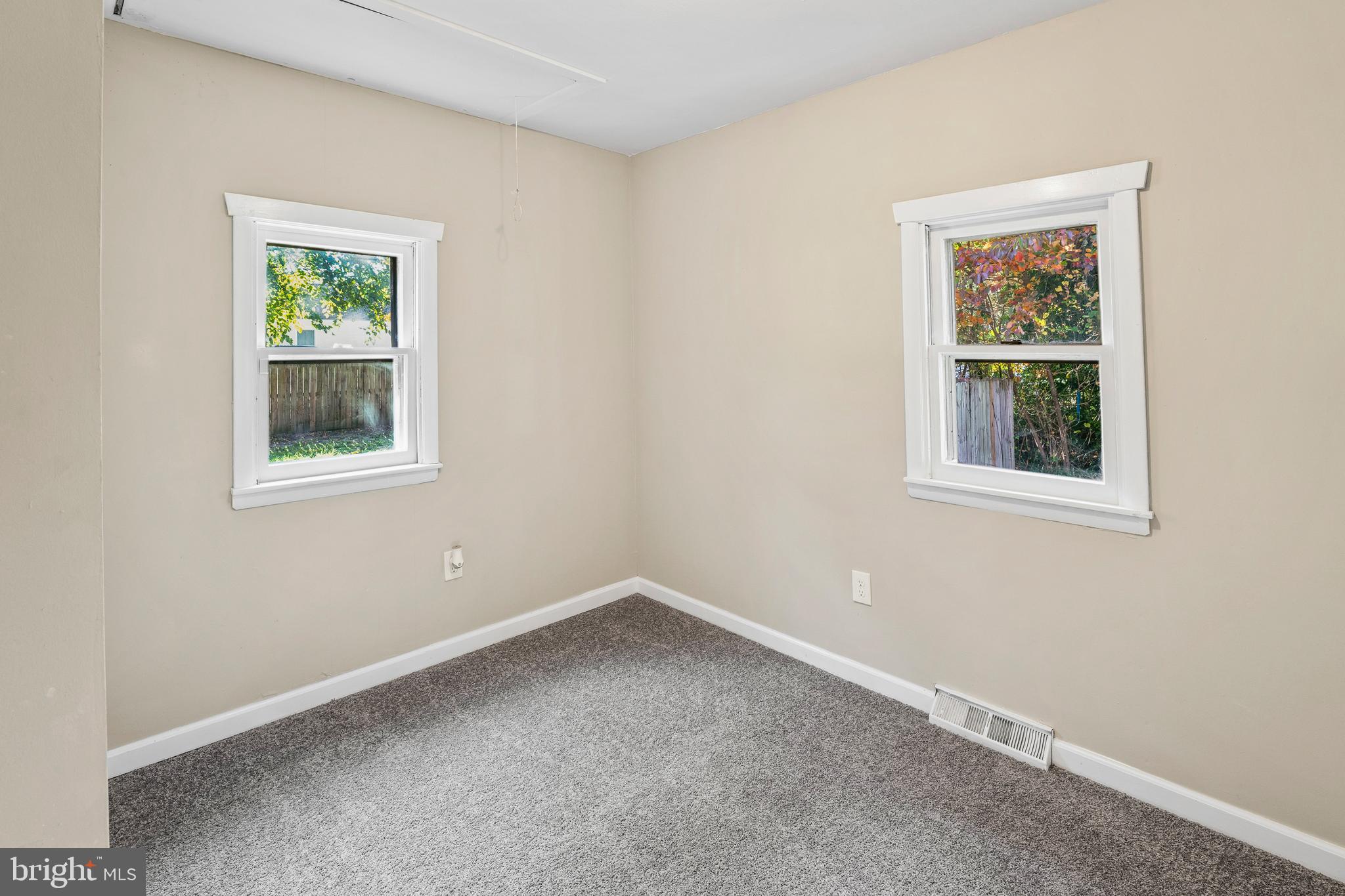 83 Rutgers Road Pennsville, NJ 08070 - Photo 15 of 23 a view of an empty room with a window