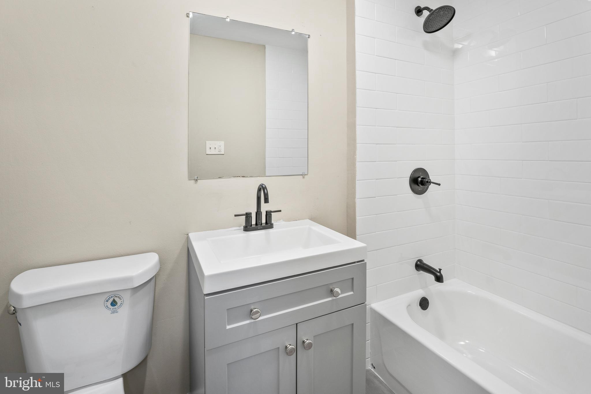 83 Rutgers Road Pennsville, NJ 08070 - Photo 17 of 23 a bathroom with a sink a toilet and shower