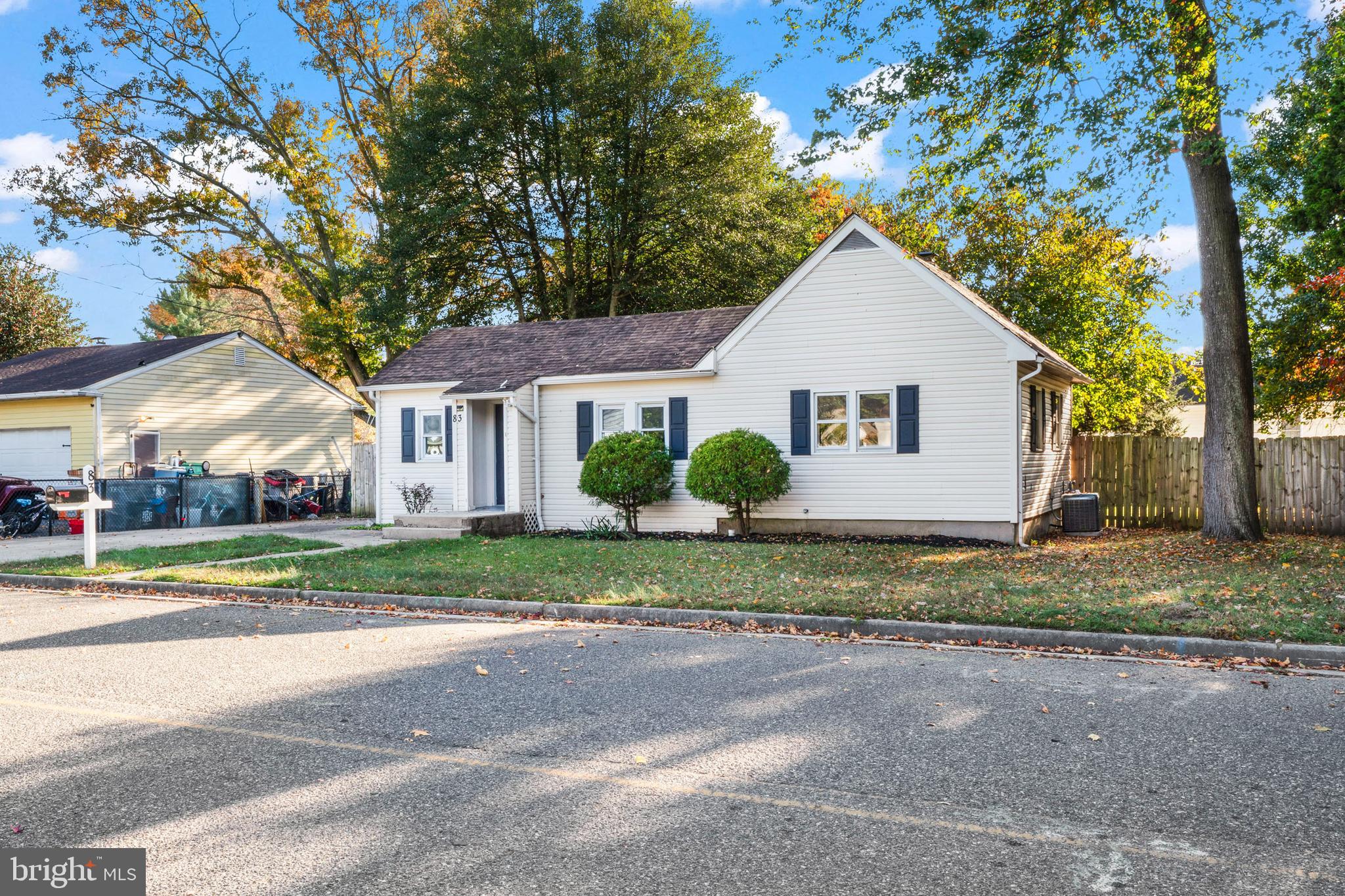 83 Rutgers Road Pennsville, NJ 08070 - Photo 3 of 23 a view of a house with a yard and large trees