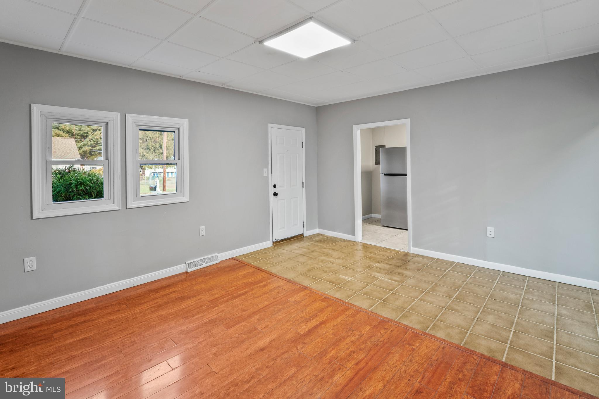 83 Rutgers Road Pennsville, NJ 08070 - Photo 7 of 23 a view of empty room with wooden floor
