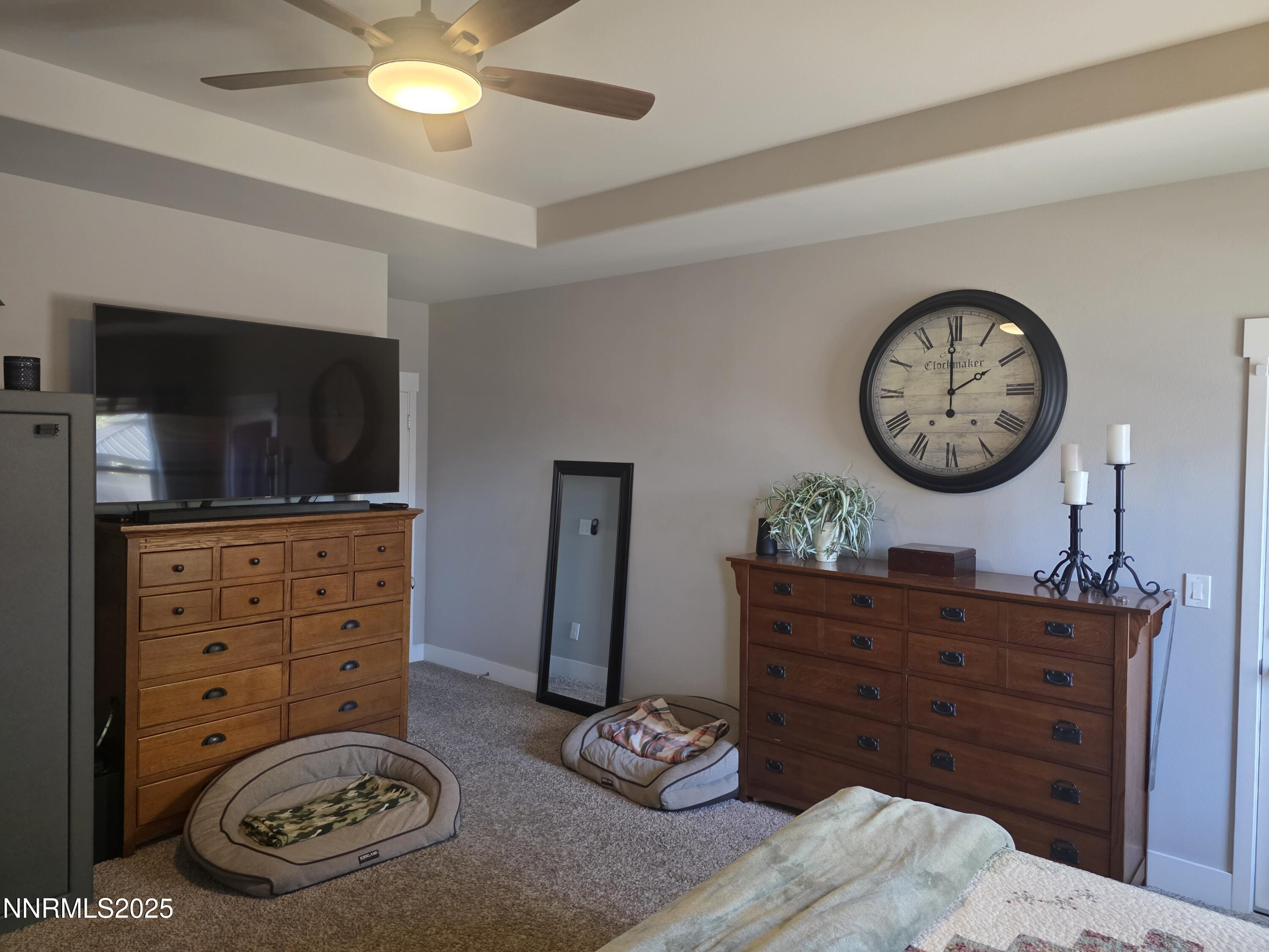 1145 Cheatgrass Drive, Unit BETWEEN DAFFODIL AND ALMOND CREEK Dayton, NV 89403 - Photo 15 of 40 a living room with furniture and a flat screen tv