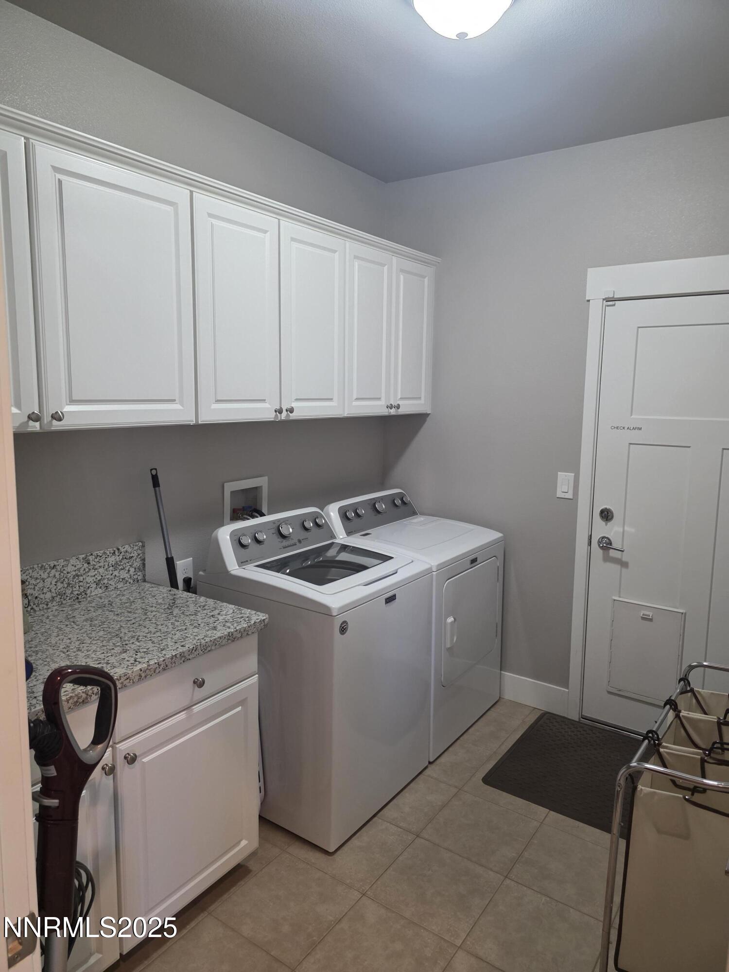 1145 Cheatgrass Drive, Unit BETWEEN DAFFODIL AND ALMOND CREEK Dayton, NV 89403 - Photo 22 of 40 a view of a storage and utility room with washer and dryer
