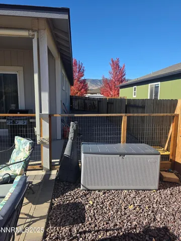 a view of a balcony with chair and table