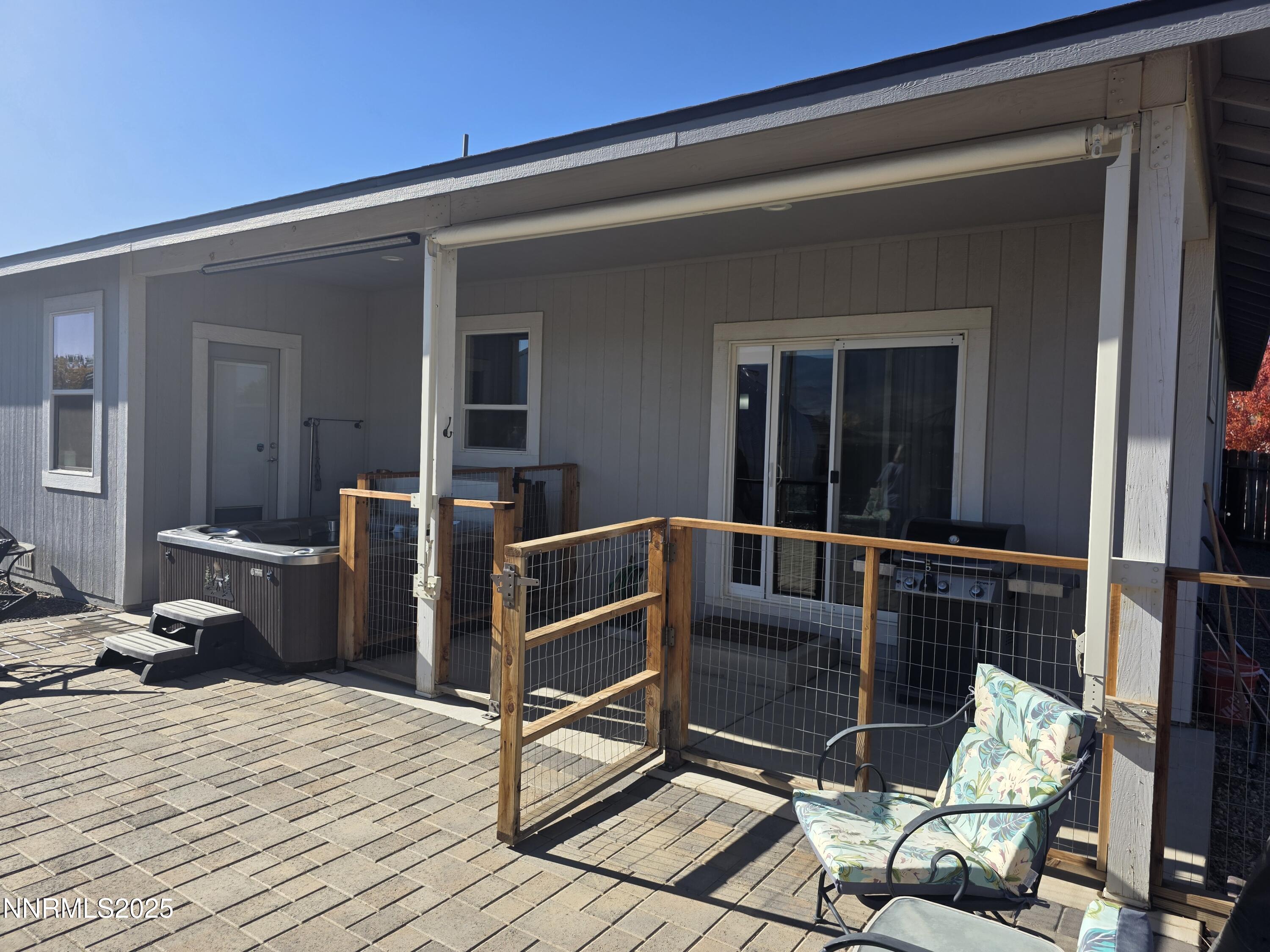 1145 Cheatgrass Drive, Unit BETWEEN DAFFODIL AND ALMOND CREEK Dayton, NV 89403 - Photo 26 of 40 a view of a balcony with chair and table