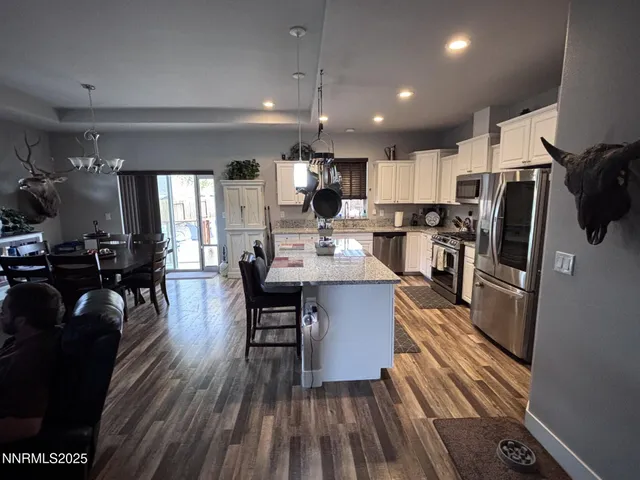 a view of kitchen and dining room with wooden floor