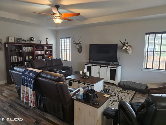 a work room with furniture and a flat screen tv