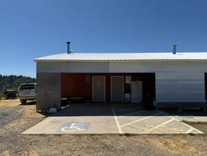 a view of a backyard with sitting area