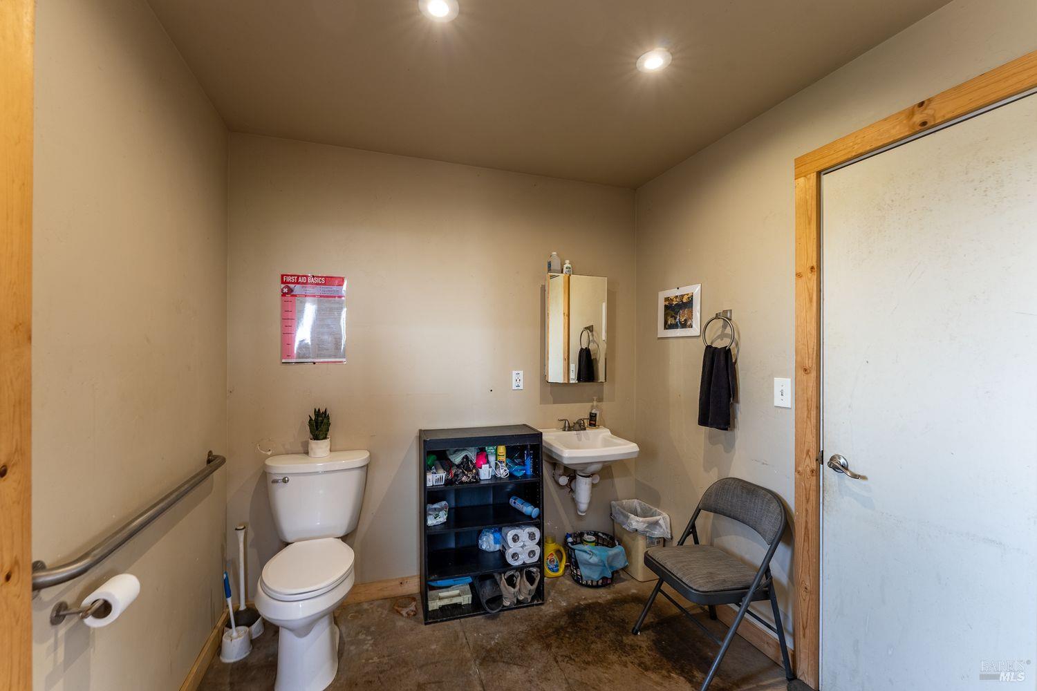 19450 Tomki Road Willits, CA 95490 - Photo 15 of 37 a bathroom with a sink toilet vanity and tub