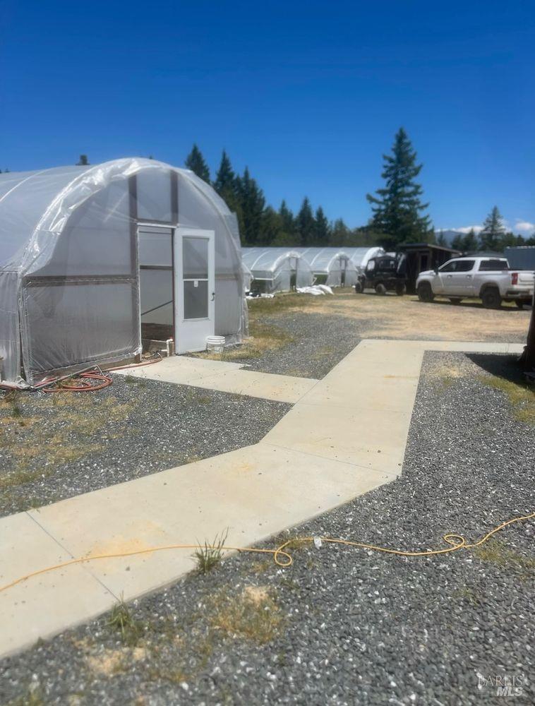 19450 Tomki Road Willits, CA 95490 - Photo 19 of 37 a view of a house with a yard