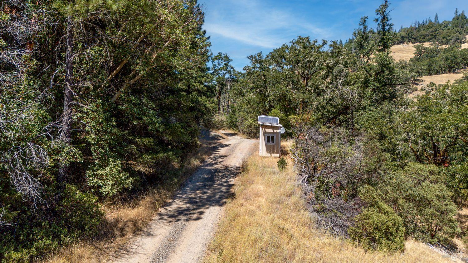 19450 Tomki Road Willits, CA 95490 - Photo 23 of 37 a view of a yard with wooden fence