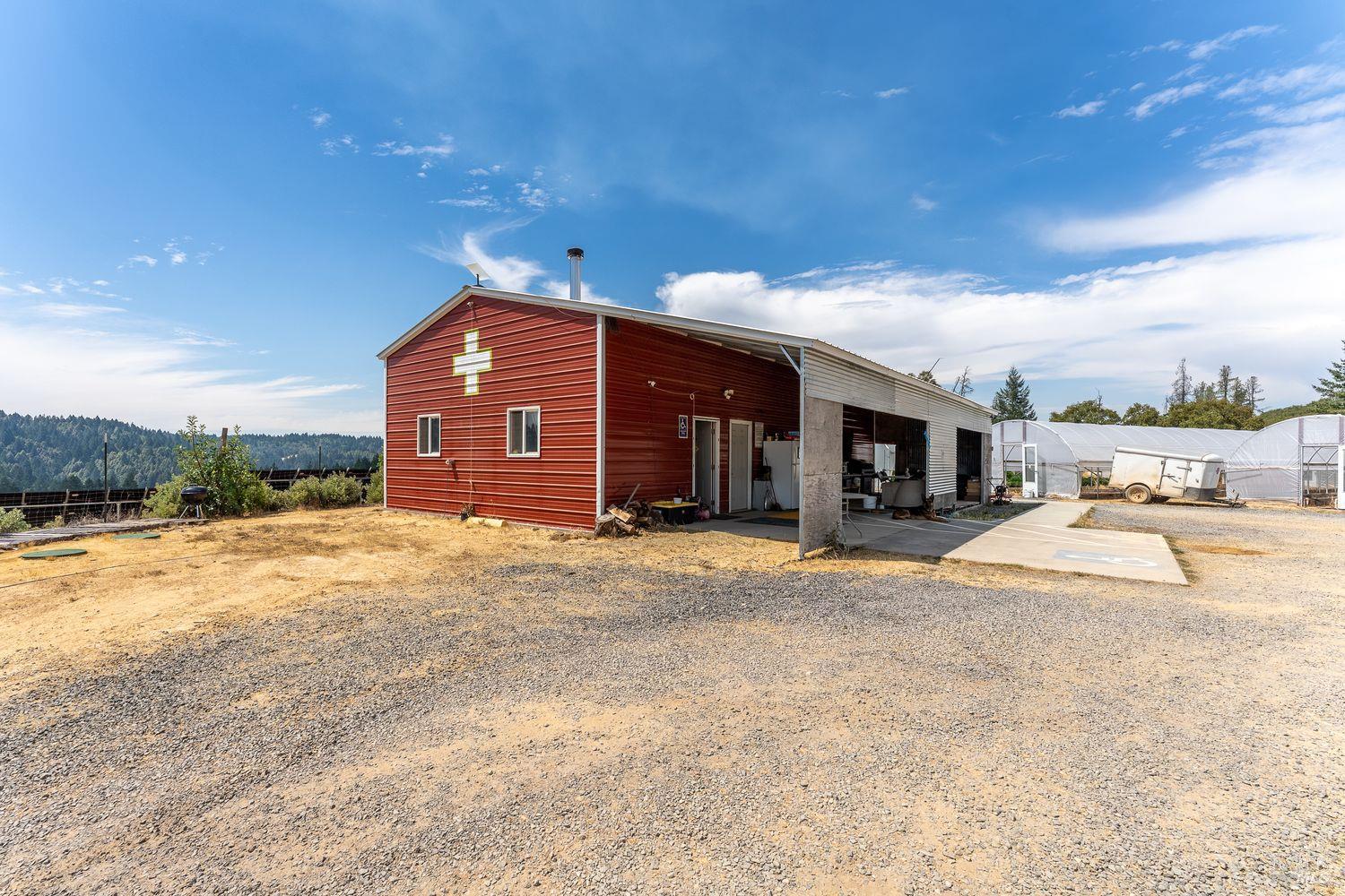 19450 Tomki Road Willits, CA 95490 - Photo 3 of 37 a view of a house with a patio and a yard