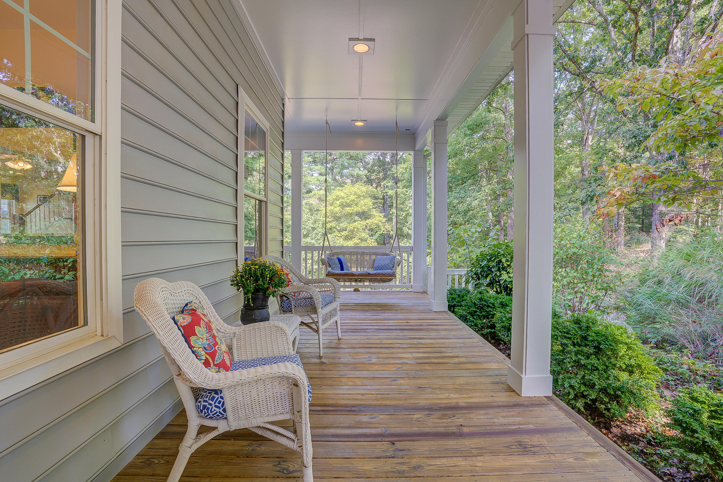 6835 Horseshoe Bend Road Goodview, VA 24095 - Photo 8 of 59 a view of a patio with table and chairs with wooden floor and plants
