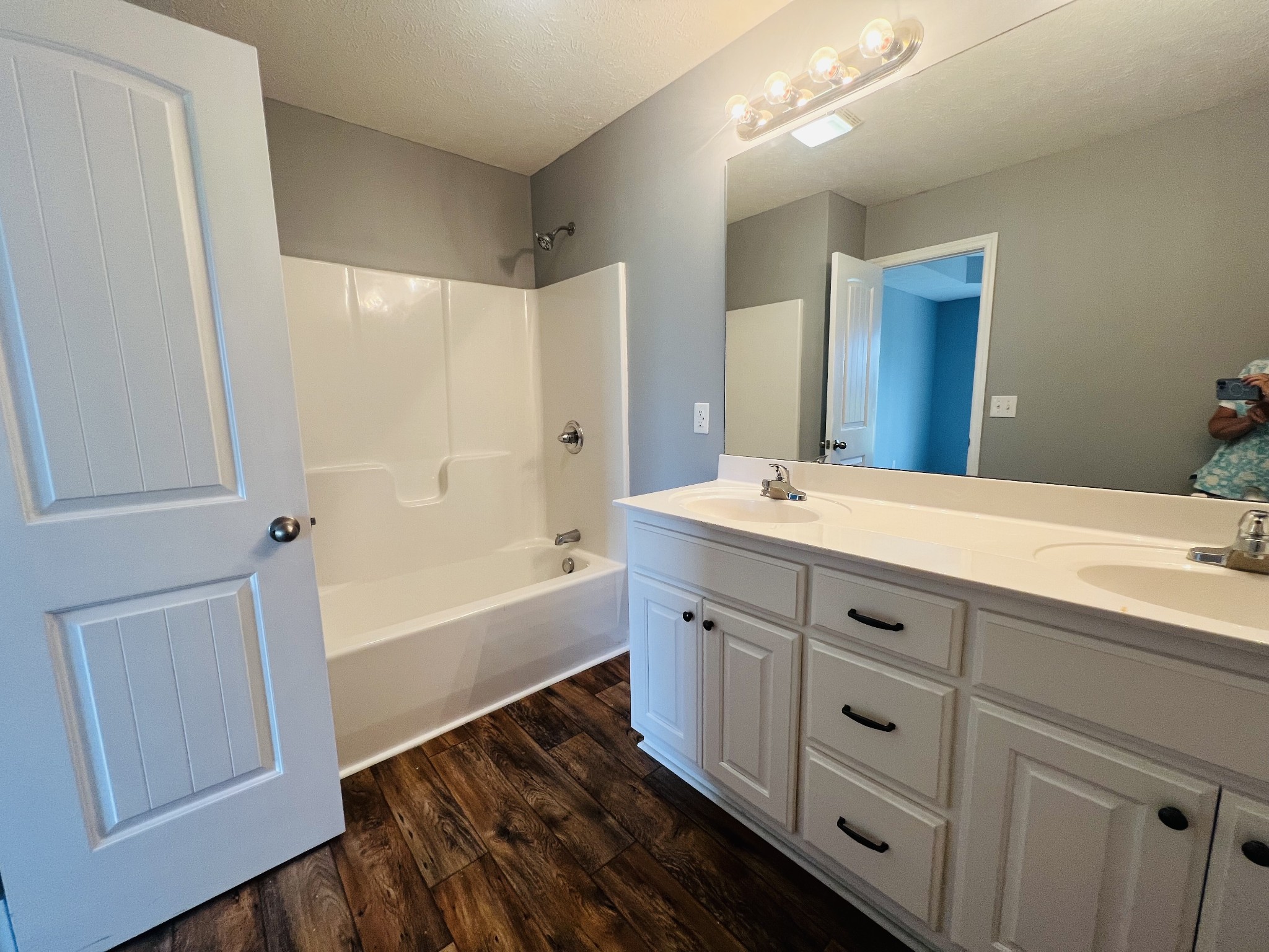 4560 Fall River Road Pulaski, TN 38478 - Photo 13 of 28 a bathroom with a tub sink and mirror