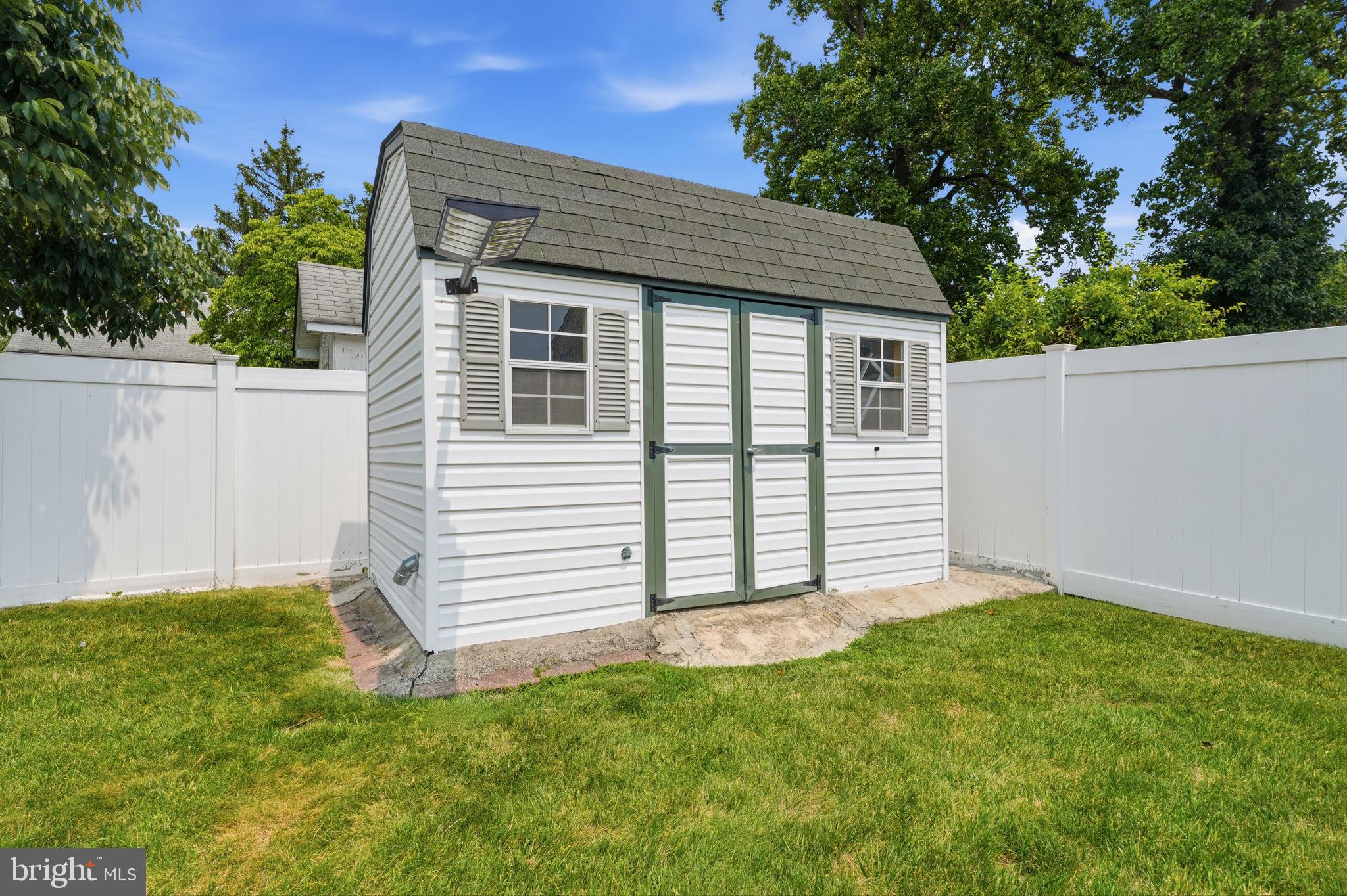2347 Maple Avenue Croydon, PA 19021 - Photo 44 of 60 Charming garden shed in lush greenery.