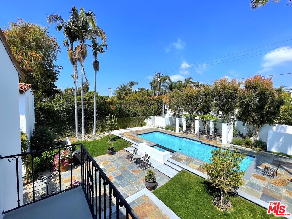 710 Walden Drive Beverly Hills, CA 90210 - Photo 16 of 20 a view of a house with pool and sitting area