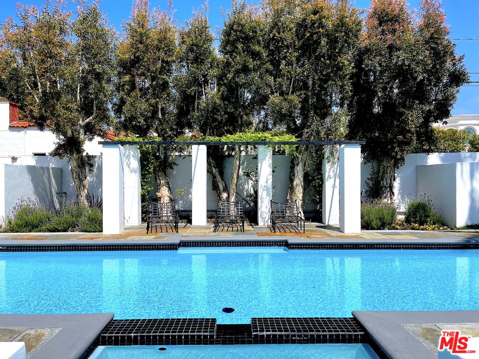 710 Walden Drive Beverly Hills, CA 90210 - Photo 19 of 20 a view of a house with a swimming pool
