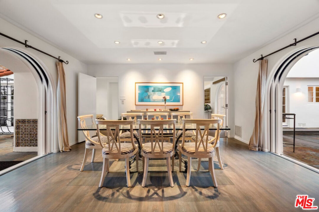 710 Walden Drive Beverly Hills, CA 90210 - Photo 7 of 20 a view of a a dining room with furniture window and wooden floor