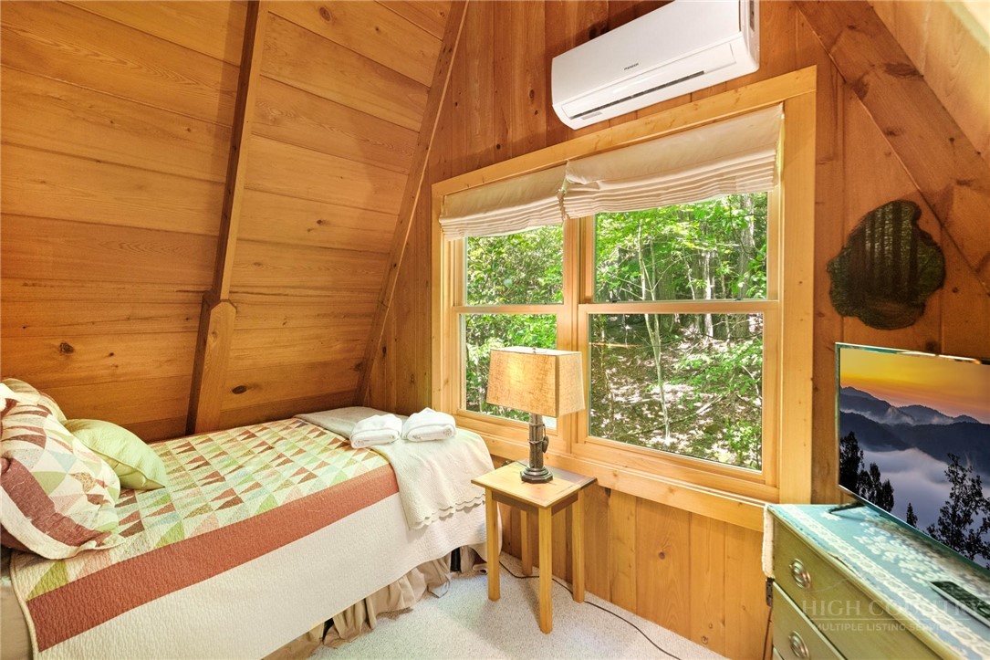 268 Cherry Drive Boone, NC 28607 - Photo 20 of 29 a bedroom with a bed and a window