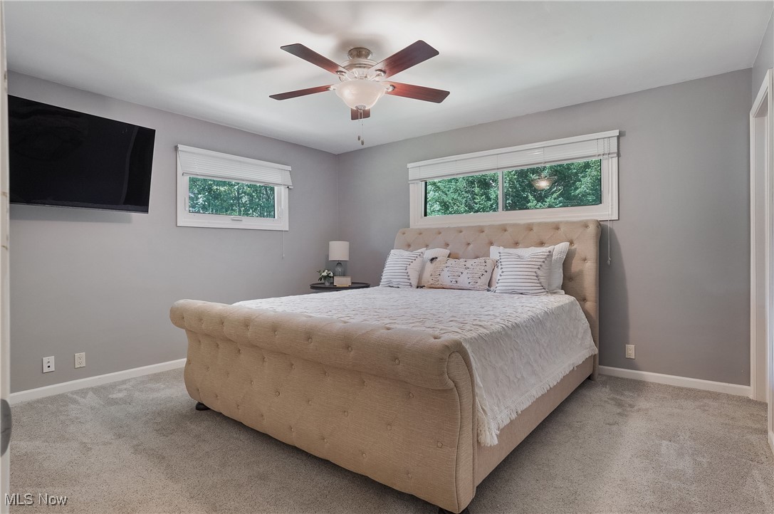 4555 Ranchwood Road Akron, OH 44333 - Photo 15 of 43 Bedroom featuring light colored carpet and ceiling fan