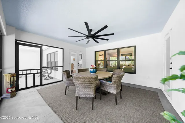 a view of a hallway with entryway wooden floor and front door