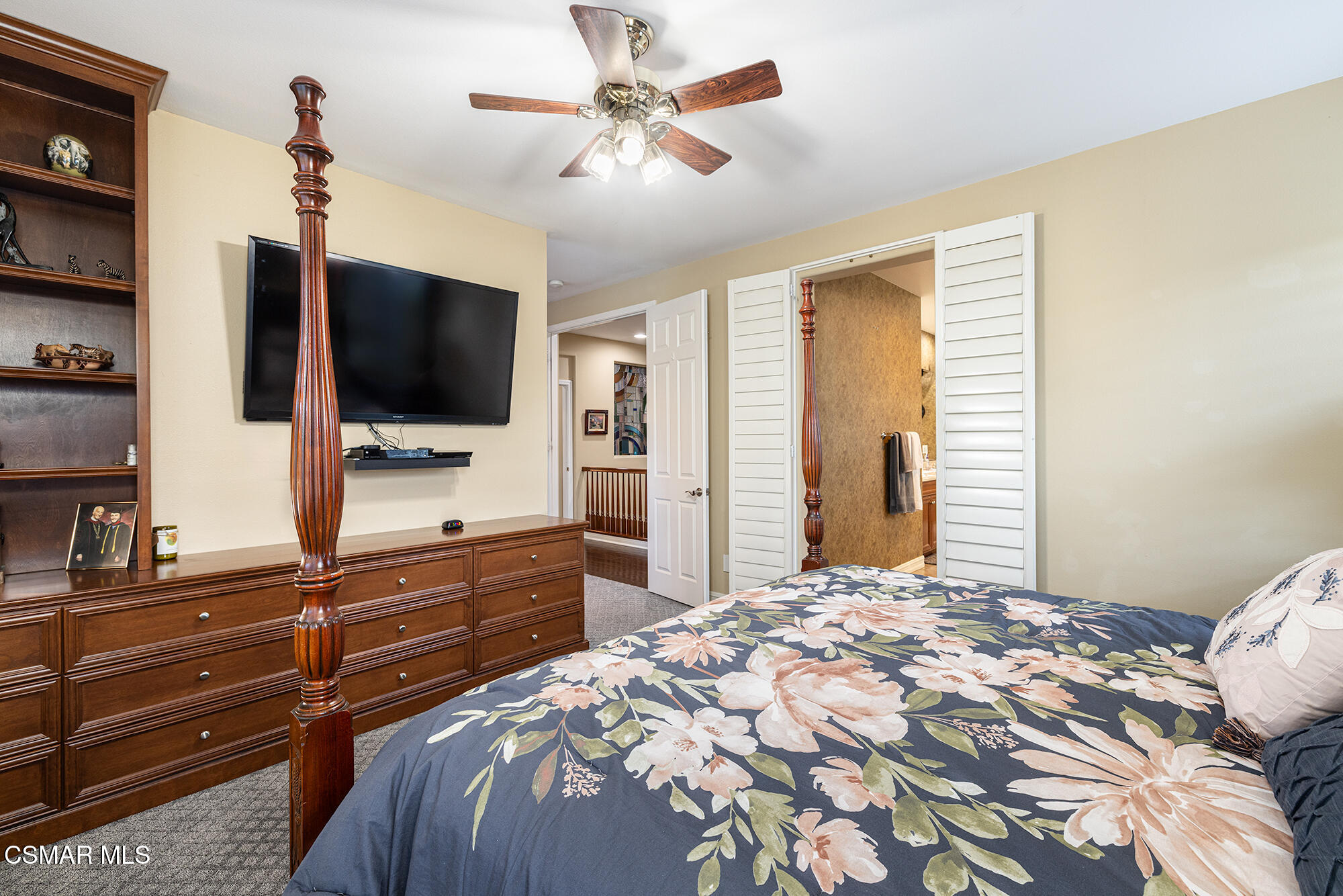 5019 Corral Street Simi Valley, CA 93063 - Photo 19 of 50 a bedroom with a bed and a flat screen tv