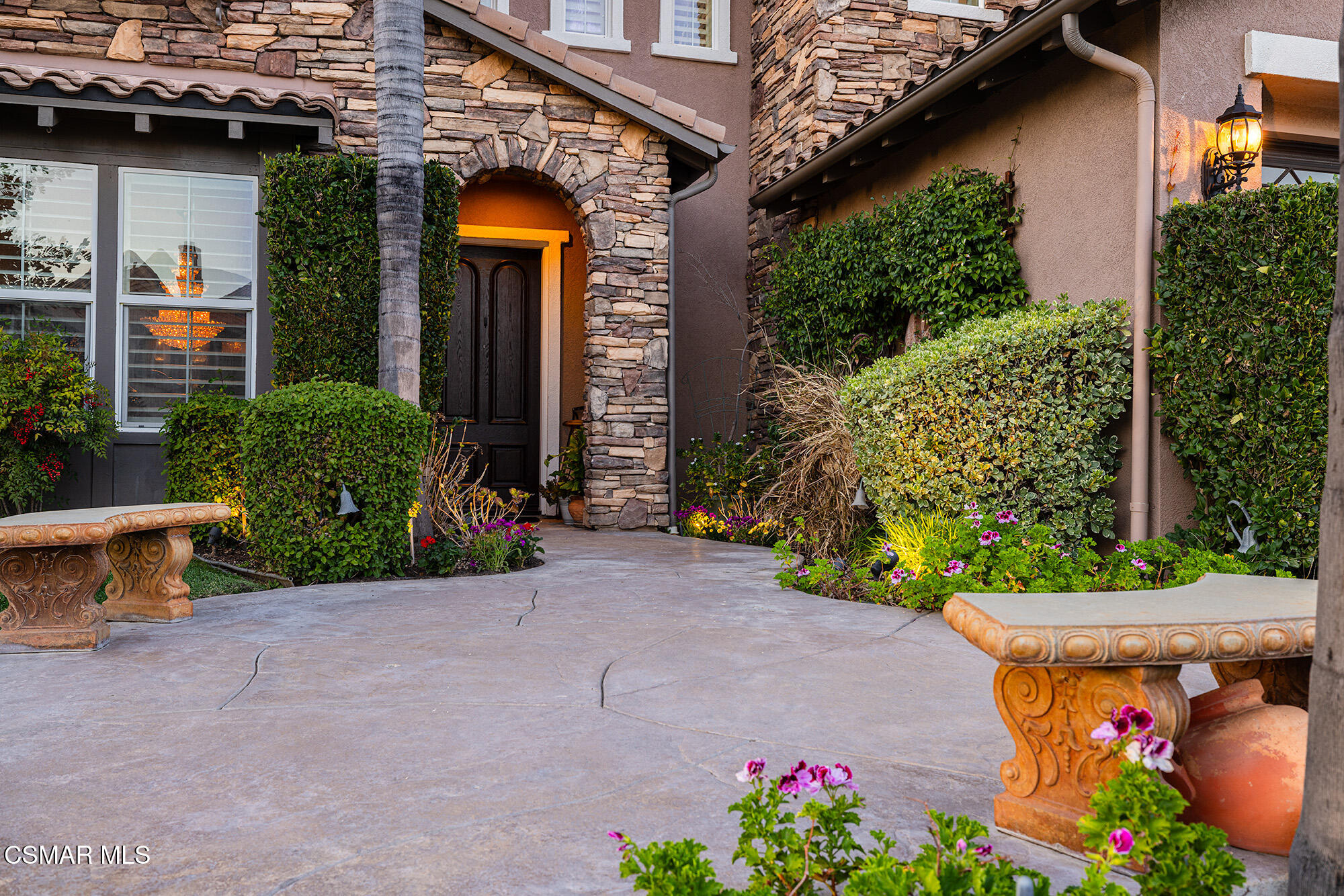 5019 Corral Street Simi Valley, CA 93063 - Photo 2 of 50 a view of a house with potted plants