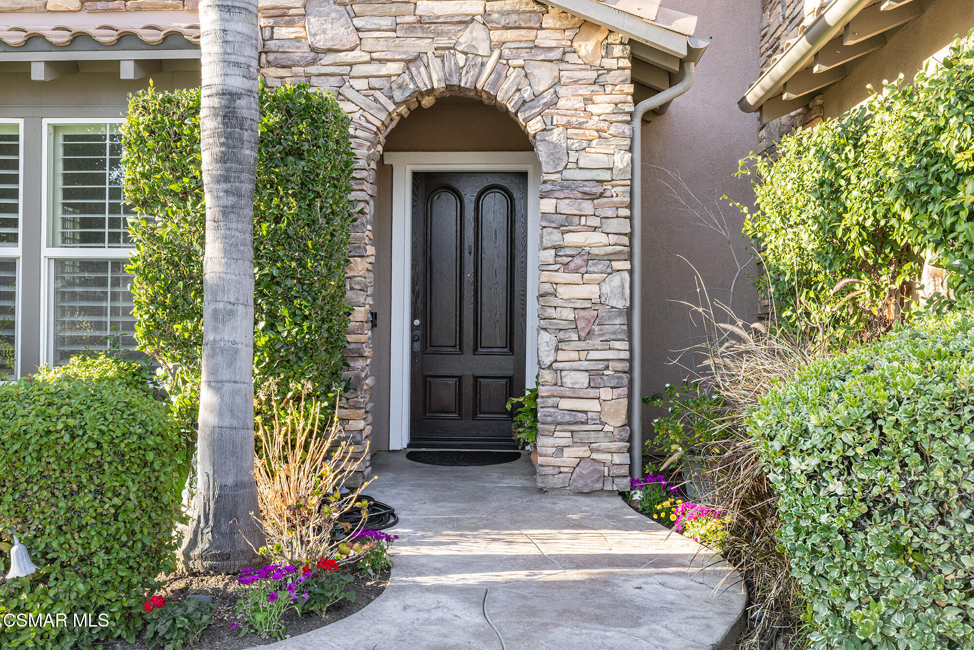 5019 Corral Street Simi Valley, CA 93063 - Photo 3 of 50 front view of a house with potted plants