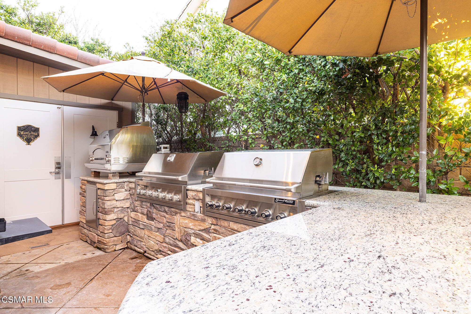 5019 Corral Street Simi Valley, CA 93063 - Photo 32 of 50 a view of a backyard with chairs and a small yard