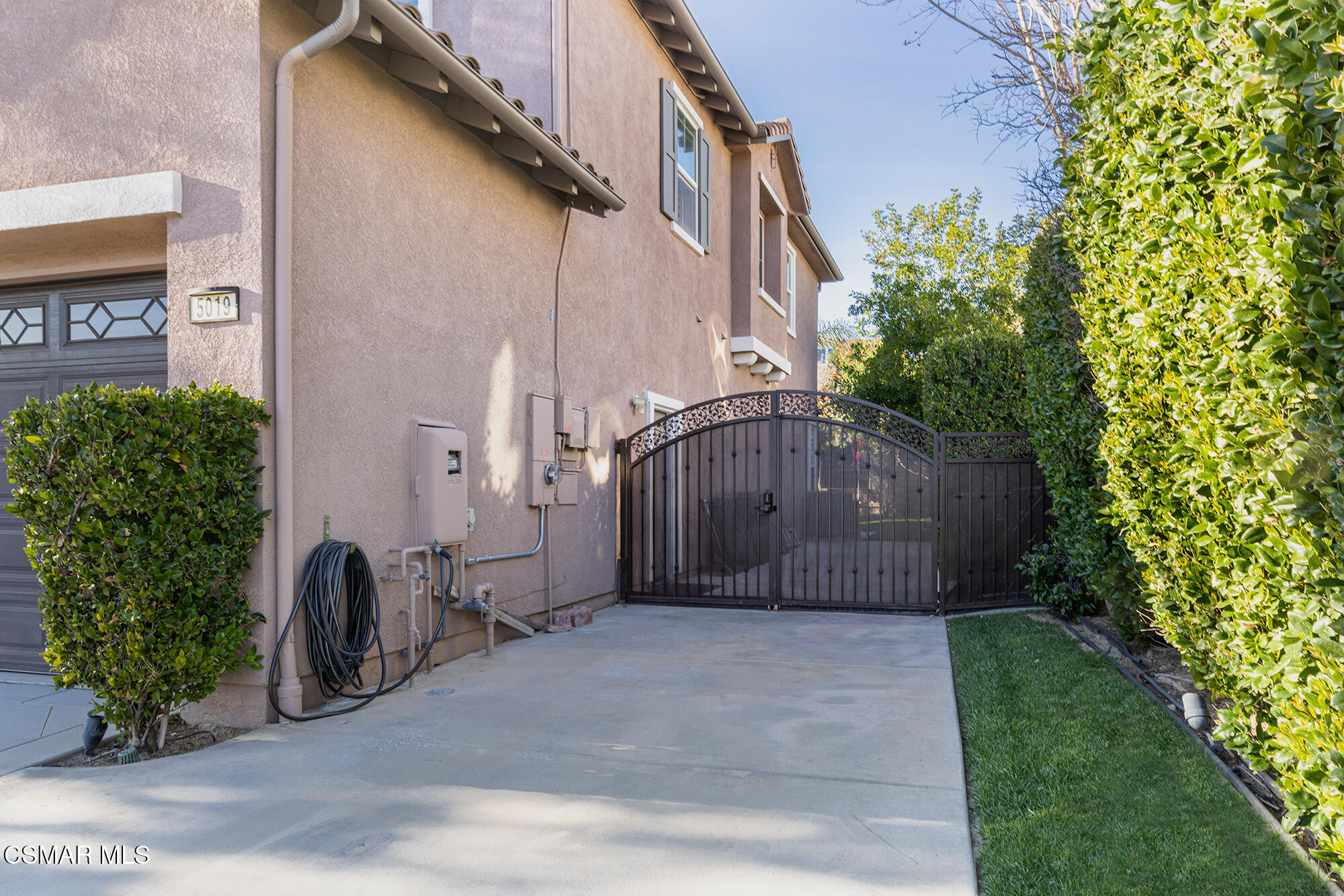 5019 Corral Street Simi Valley, CA 93063 - Photo 4 of 50 a front view of a house with a garden