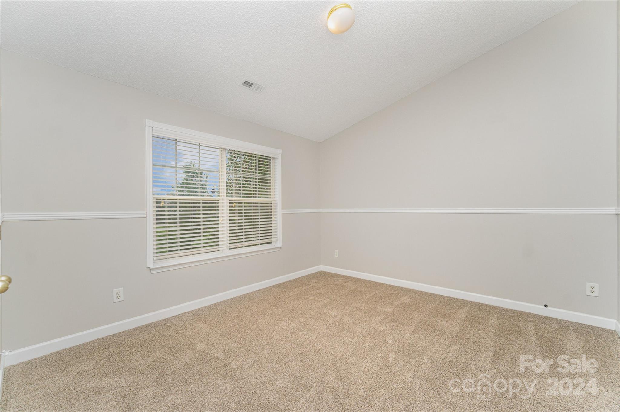 5018 Revelation Way Monroe, NC 28110 - Photo 14 of 19 a view of an empty room with a window