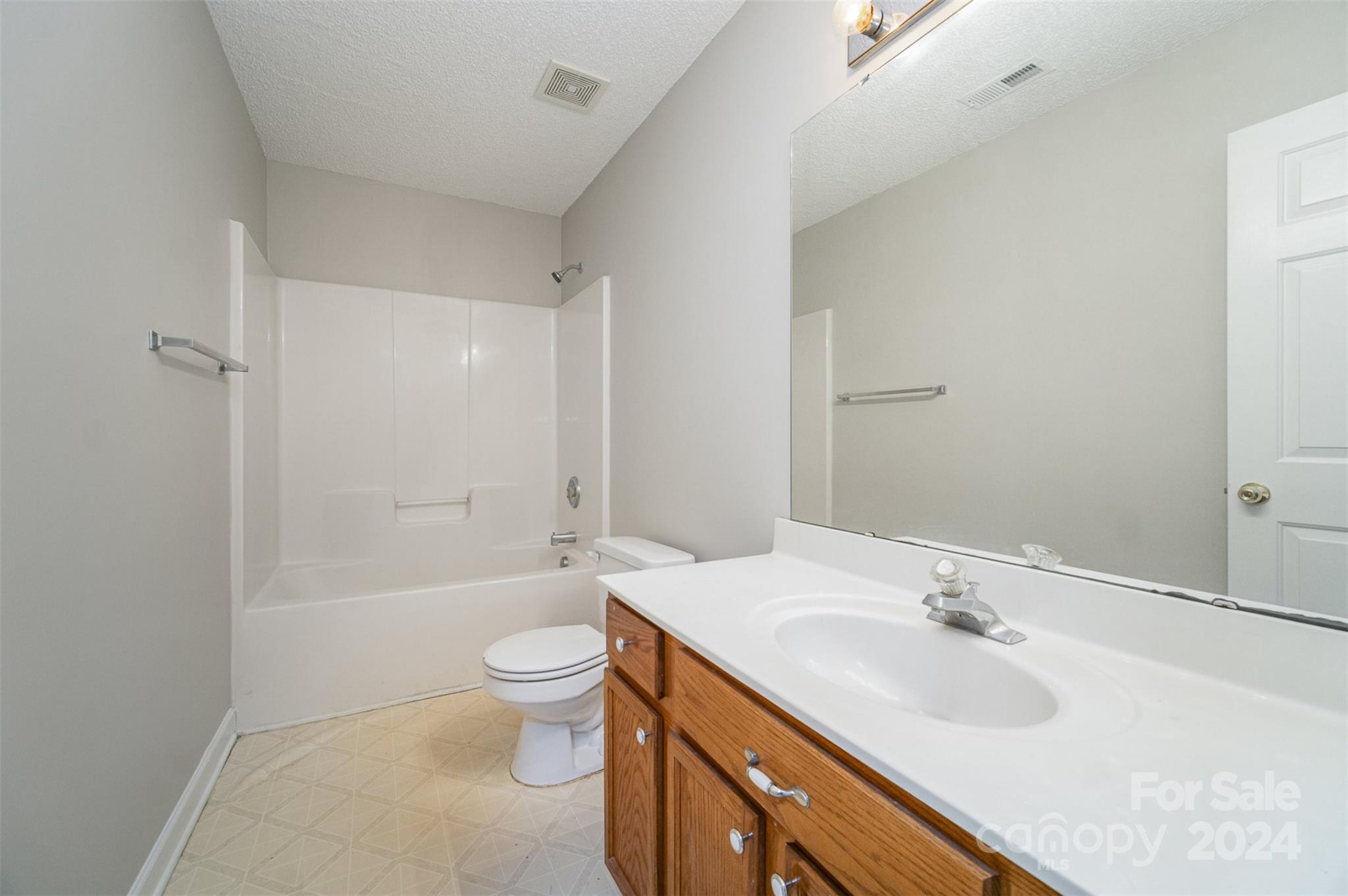 5018 Revelation Way Monroe, NC 28110 - Photo 17 of 19 a bathroom with a sink a toilet and shower