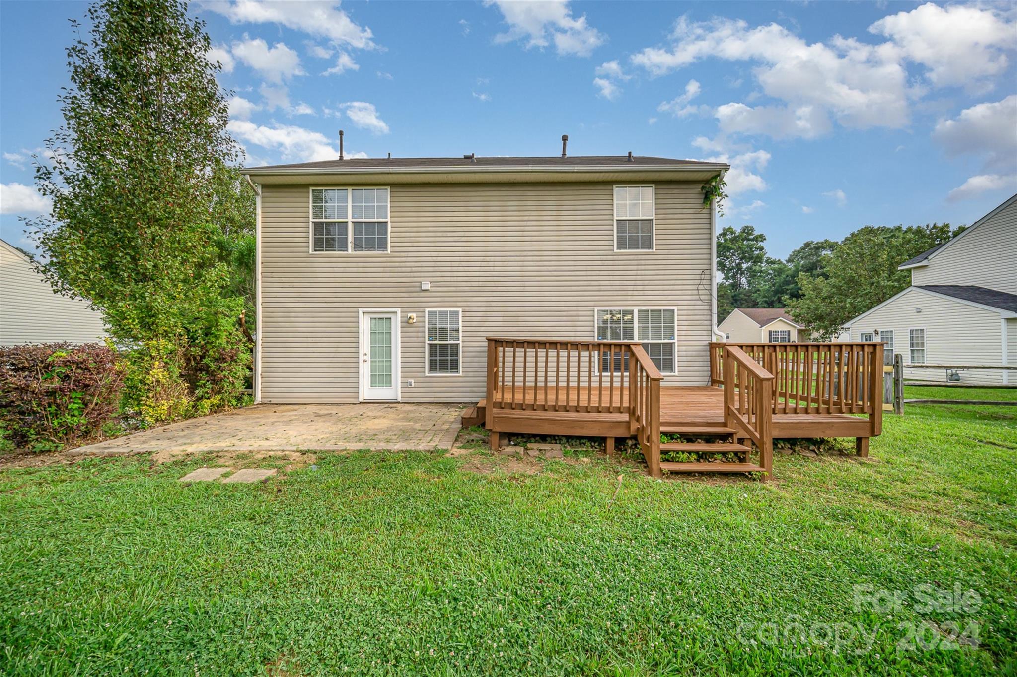 5018 Revelation Way Monroe, NC 28110 - Photo 19 of 19 a view of a house with a yard and deck