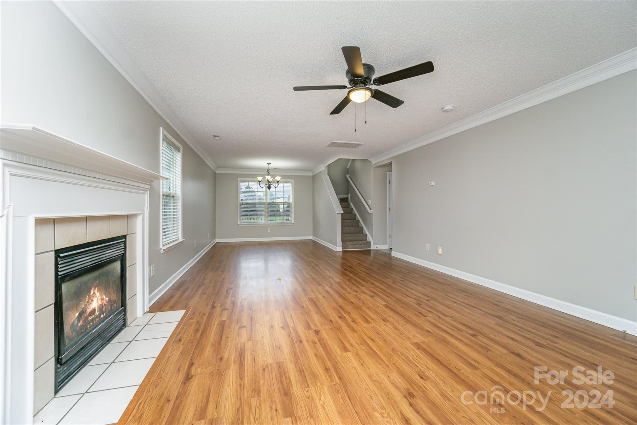 5018 Revelation Way Monroe, NC 28110 - Photo 4 of 19 a view of empty room with wooden floor and fireplace