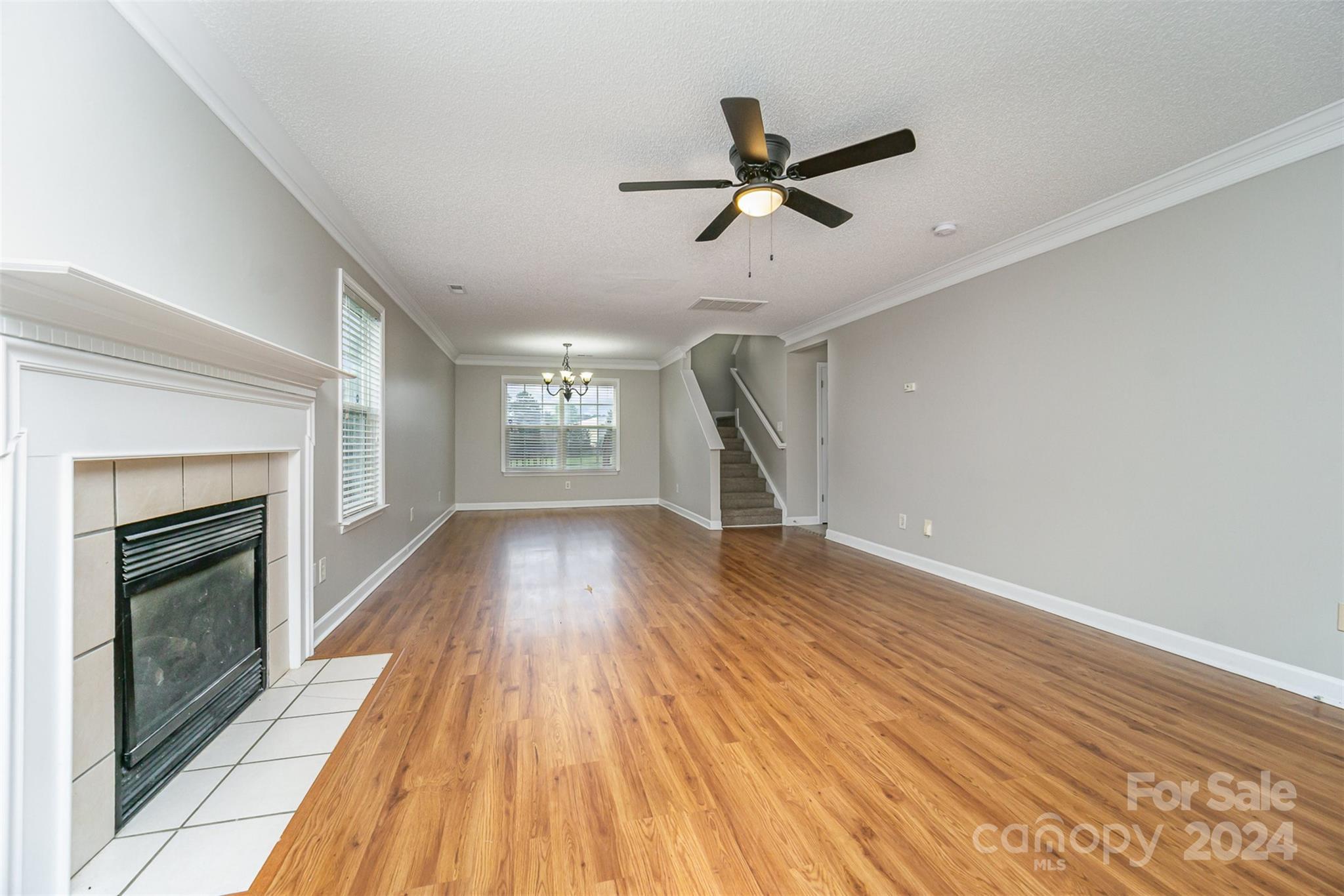 5018 Revelation Way Monroe, NC 28110 - Photo 5 of 19 a view of empty room with wooden floor and fireplace