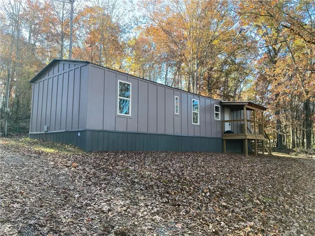 a backyard of a house with wooden fence