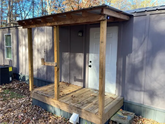 a view of a house with a window and stairs