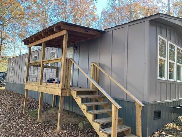 a view of a yard with a house in the background