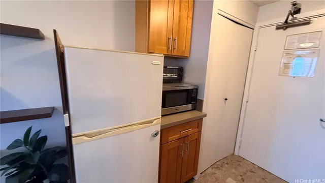 a view of storage and utility room with washer and dryer