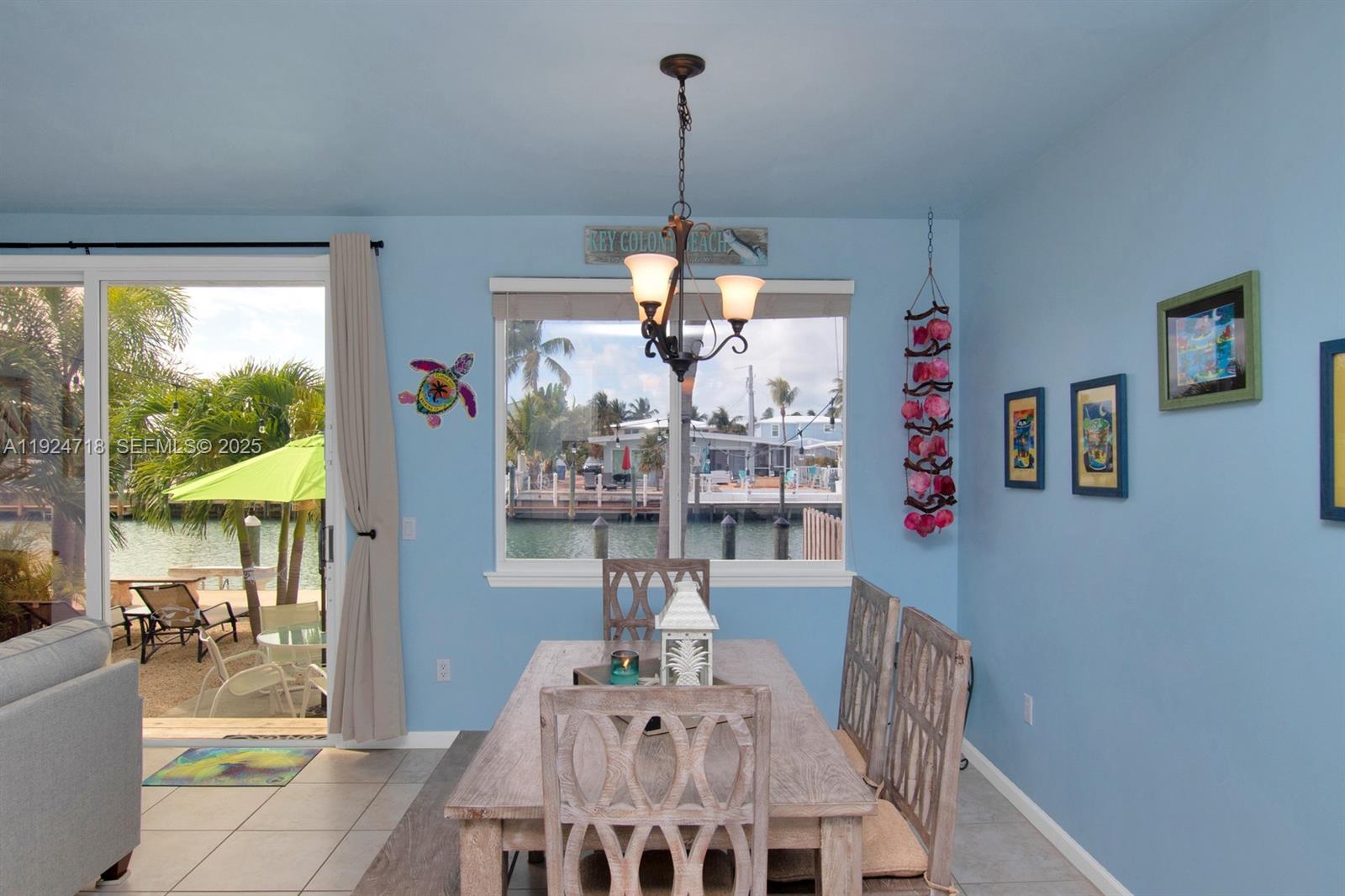 461 3rd Street Key Colony Beach, FL 33051 - Photo 14 of 79 a view of a dining room with furniture window and outside view