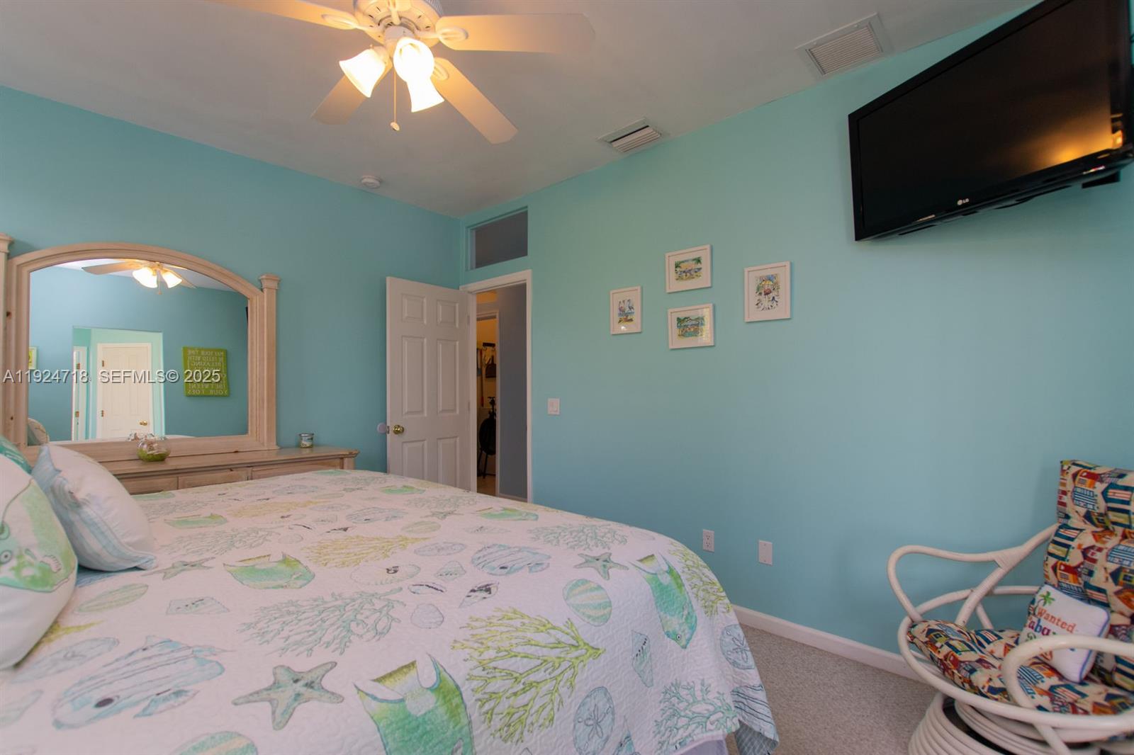 461 3rd Street Key Colony Beach, FL 33051 - Photo 26 of 79 a bedroom with a bed and a chandelier