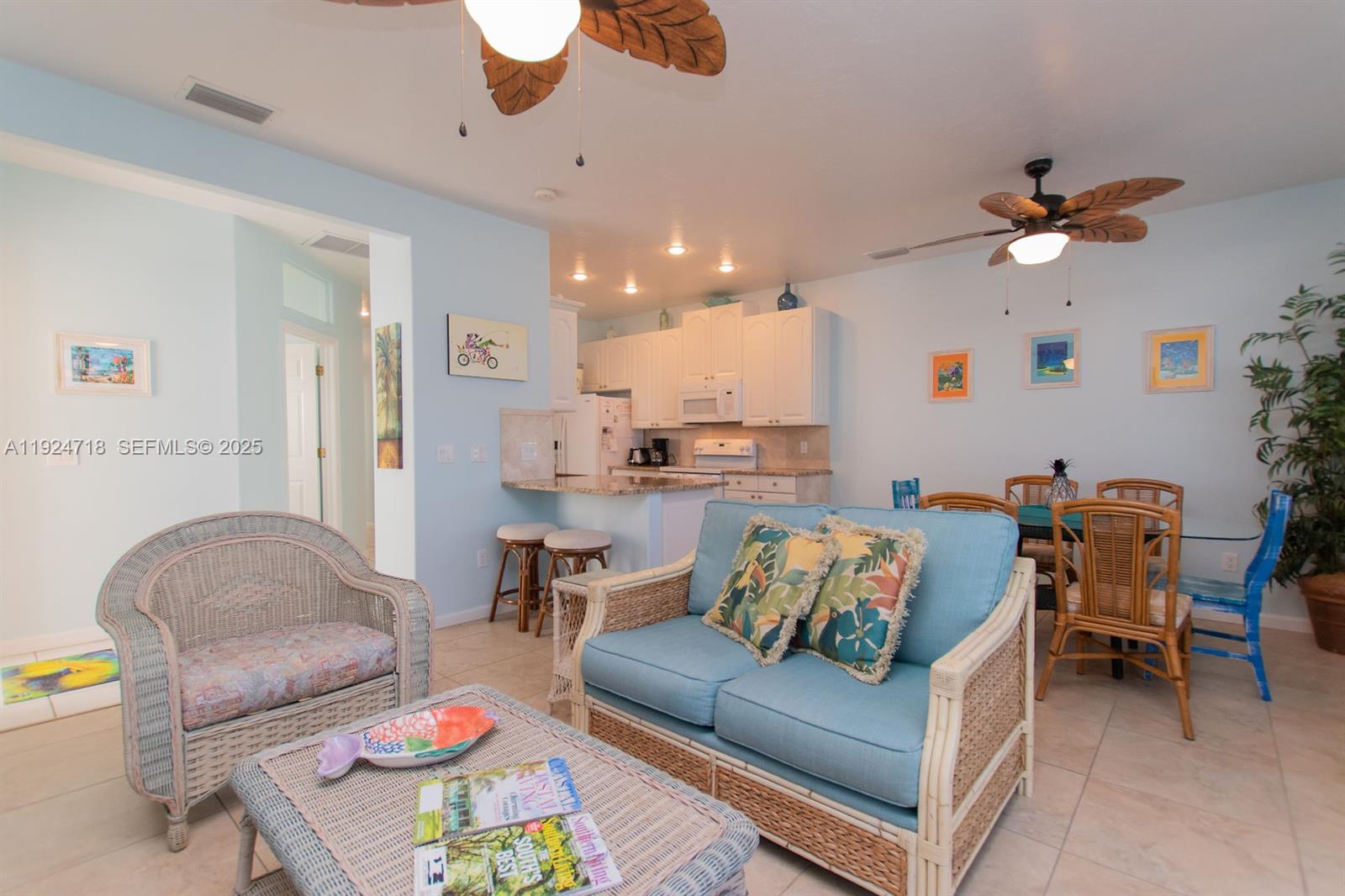 461 3rd Street Key Colony Beach, FL 33051 - Photo 51 of 79 a living room with furniture kitchen view and a chandelier