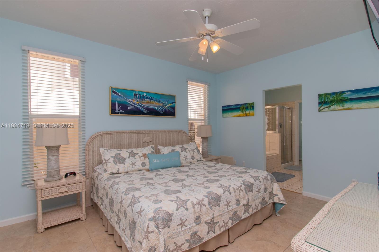 461 3rd Street Key Colony Beach, FL 33051 - Photo 57 of 79 a bedroom with a bed and a chandelier