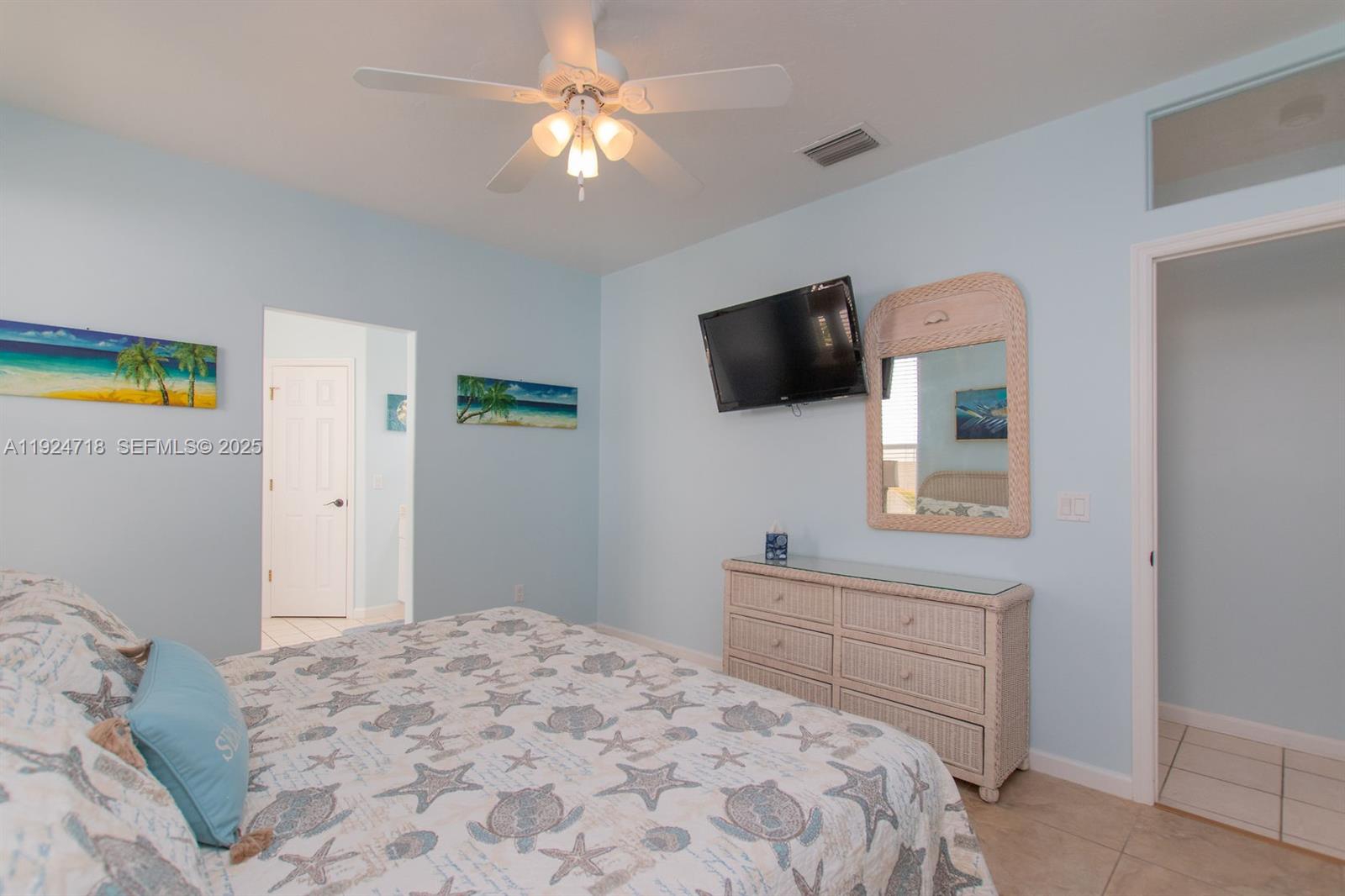 461 3rd Street Key Colony Beach, FL 33051 - Photo 58 of 79 a bedroom with a bed and a flat screen tv