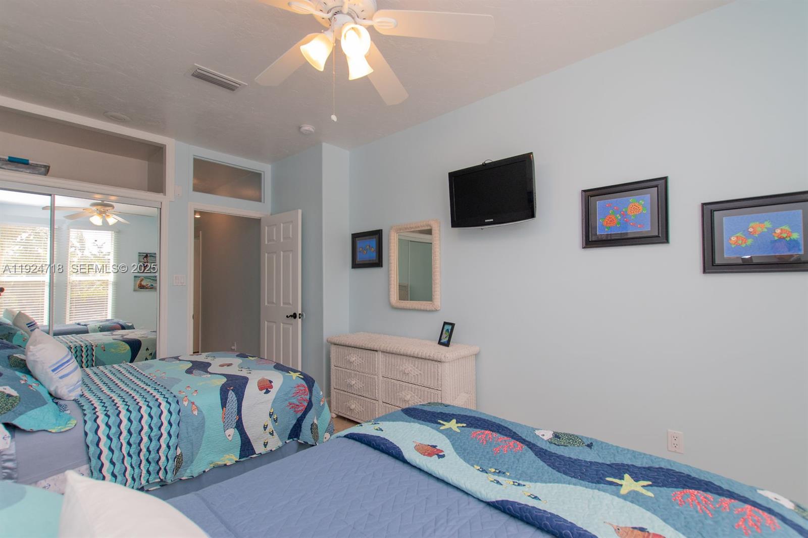 461 3rd Street Key Colony Beach, FL 33051 - Photo 70 of 79 a bedroom with furniture and a flat screen tv