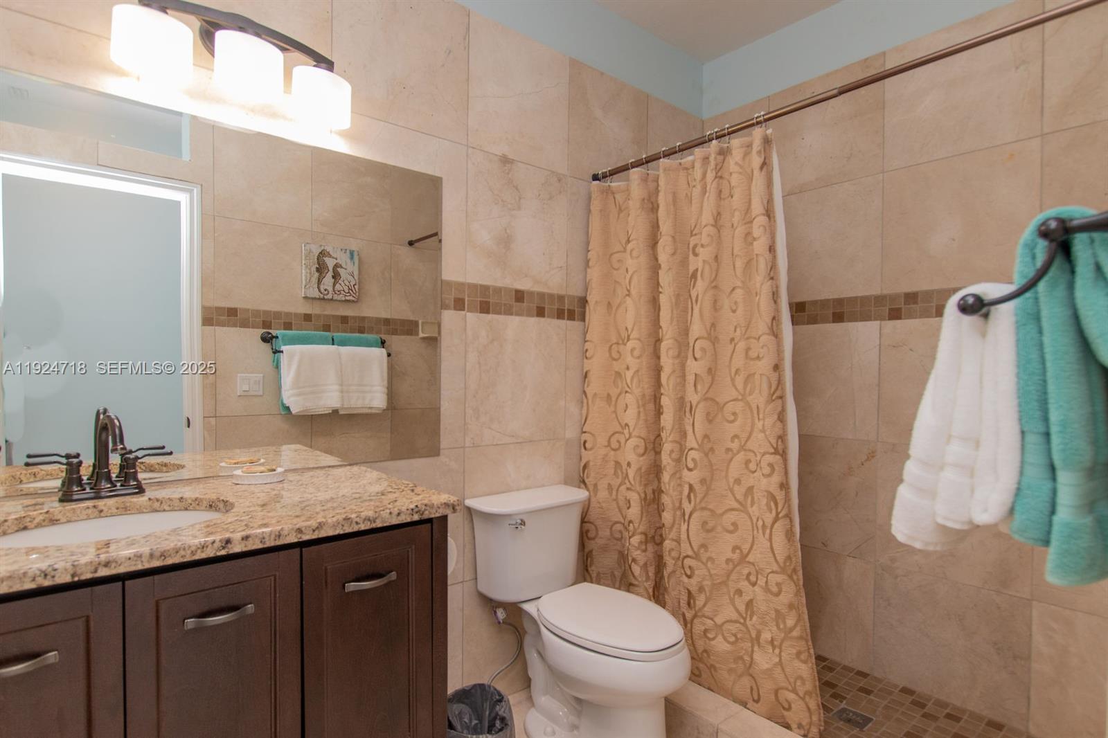 461 3rd Street Key Colony Beach, FL 33051 - Photo 71 of 79 a bathroom with a granite countertop sink toilet and shower