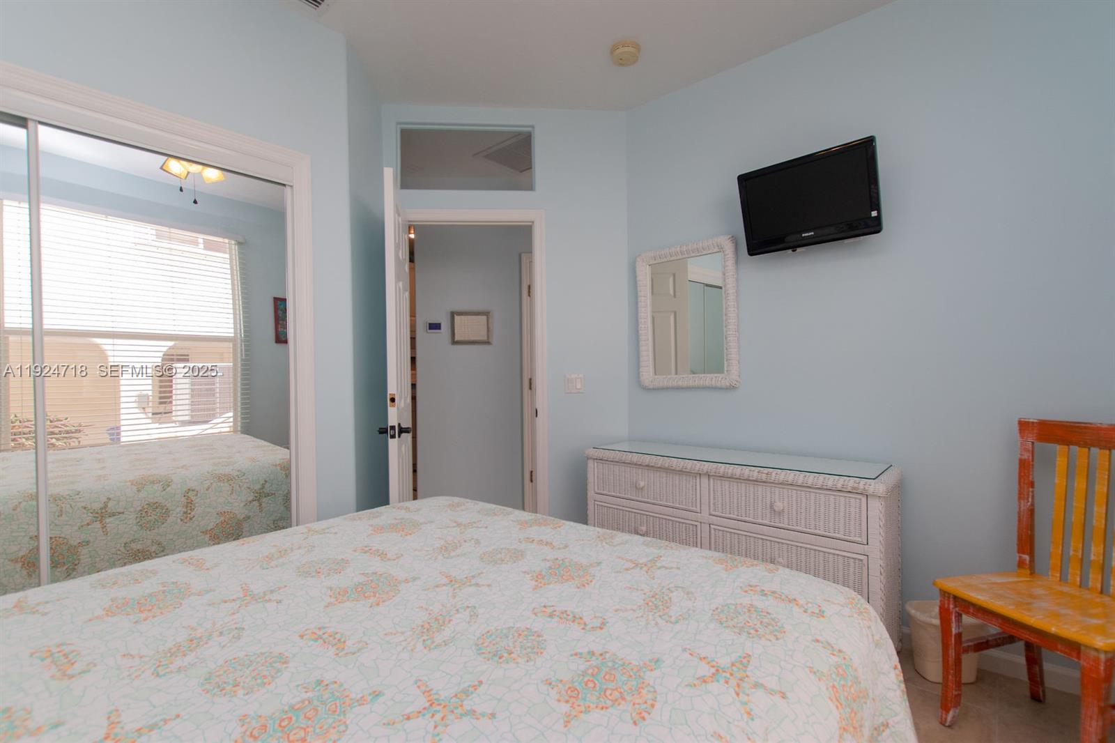 461 3rd Street Key Colony Beach, FL 33051 - Photo 74 of 79 a bedroom with a bed and a flat screen tv