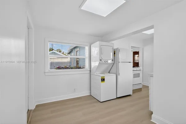a view of kitchen with furniture and natural light
