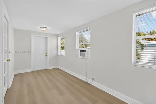 an empty room with windows