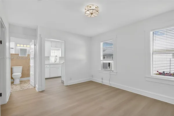 a view of an empty room with a window